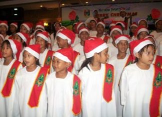 The Pattaya Orphanage choir warm up for the Christmas carols.